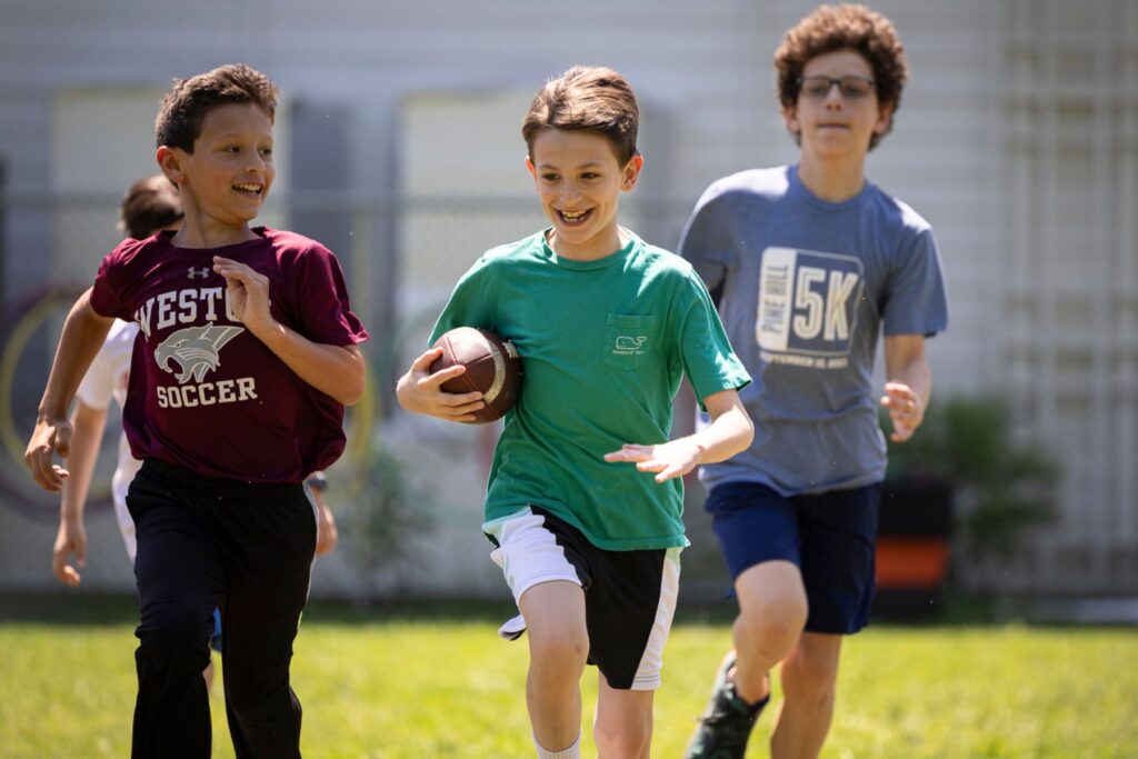 Riverbend students playing football