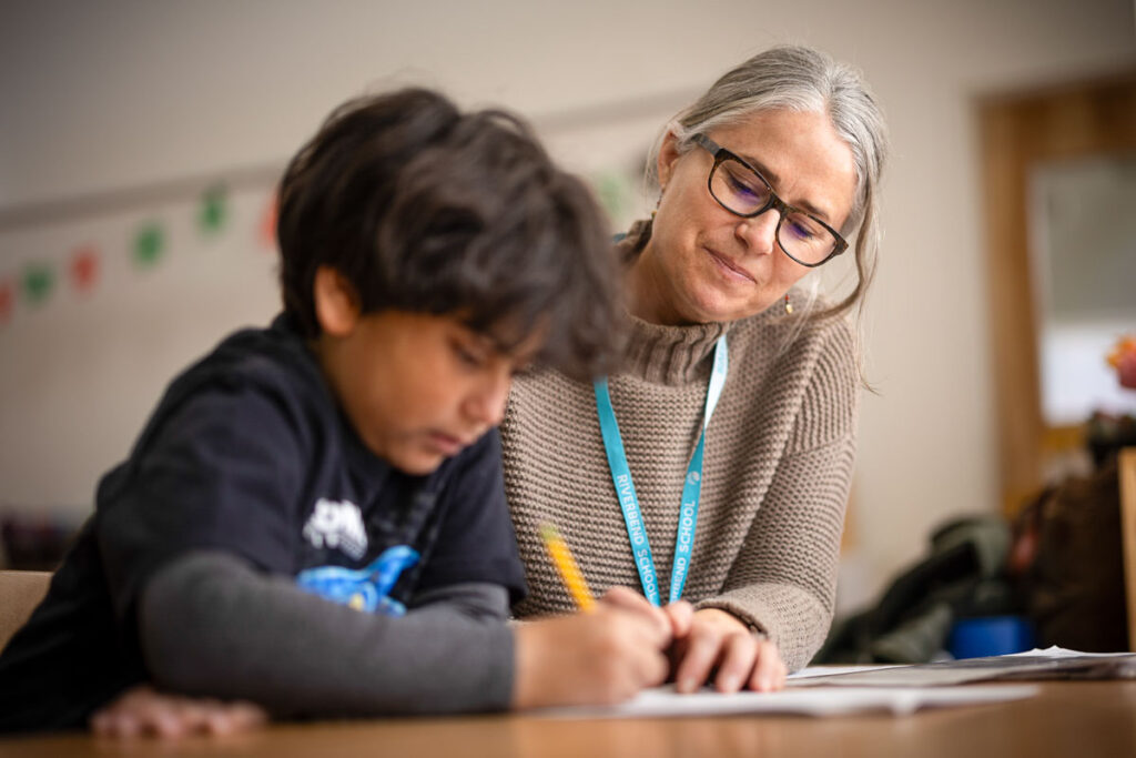 Teacher and student working at Riverbend