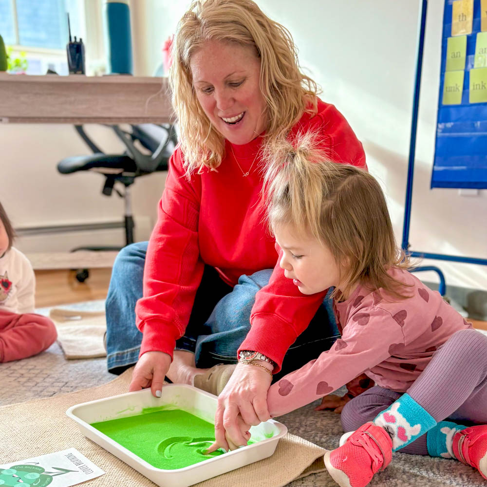 Toddler with teacher at Riverbend