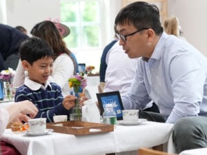 Kindergartener arranging flowers