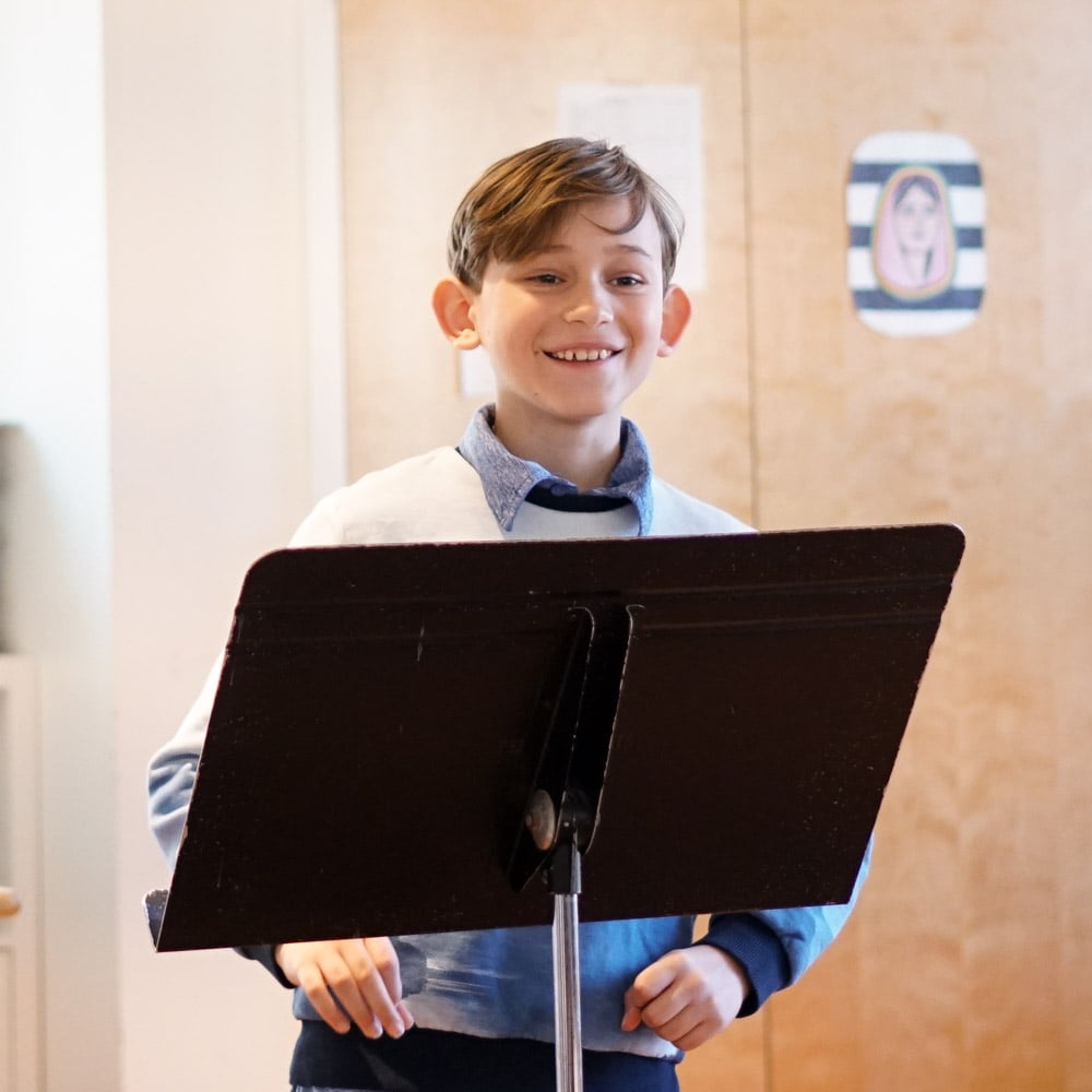 Student presenting at authors breakfast