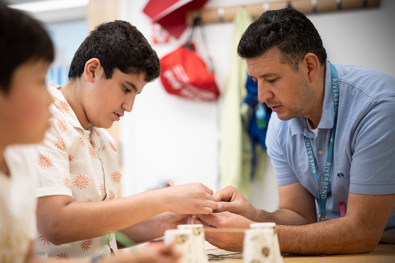 Teacher working with students at Riverbend