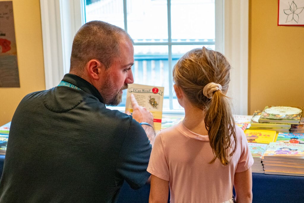Teacher and student at Riverbend book fair