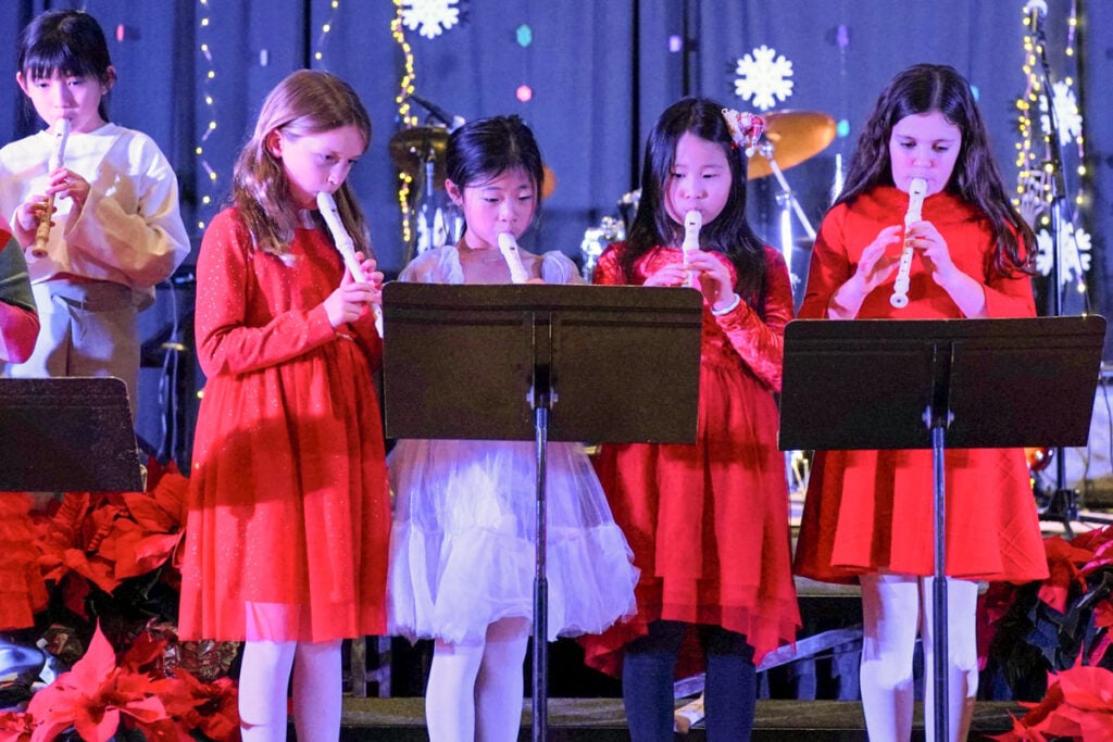 Students playing recorders
