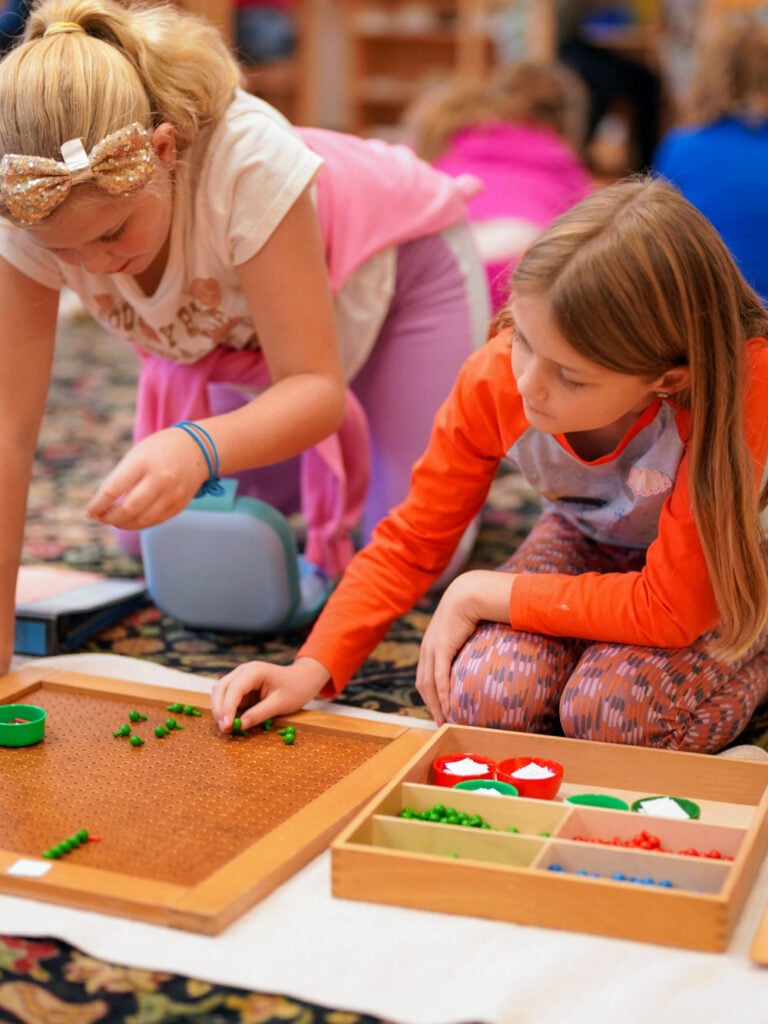 Riverbend students with Montessori materials